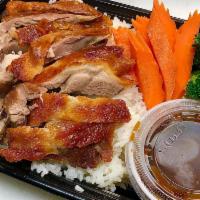 Khao Nah Phed (Duck & Rice) · Roasted Duck on Rice Served with duck sauce, streamed Broccoli, Carrots , cucumber and cilan...