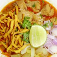 Khao Soi · Special khao Soi paste with egg noodles & crispy egg noodles, choice of meat served with pic...