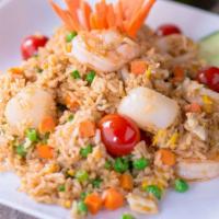 Fisherman Fried Rice · Fried rice with egg, shrimp, calamari, crab meat, peas & carrots, green onions, tomatoes, ci...