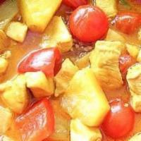 Pineapple Curry · Red curry with coconut milk, pineapples, tomatoes, bell pepper and basil leaves.