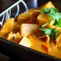 Mussman Curry · Mussaman curry paste with coconut milk, potatoes, carrots, peanut, onions.