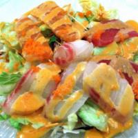 Sashimi Salad · Various cuts of sashimi on salad with Midori sauce.