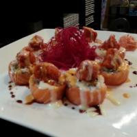 Midori Roll · Spicy tuna on top of California roll wrapped with fresh salmon served with house special sau...