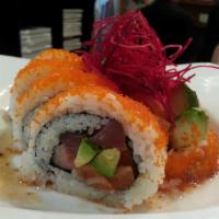 Crazy Horse Roll · Tuna, salmon, yellowtail, and avocado inside topped with masago, served with Japanese mustar...