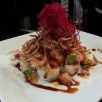 Tsunami Roll · Fresh salmon, avocado, tomato, and masago mixed with sweet and spicy sauce on top of spicy t...