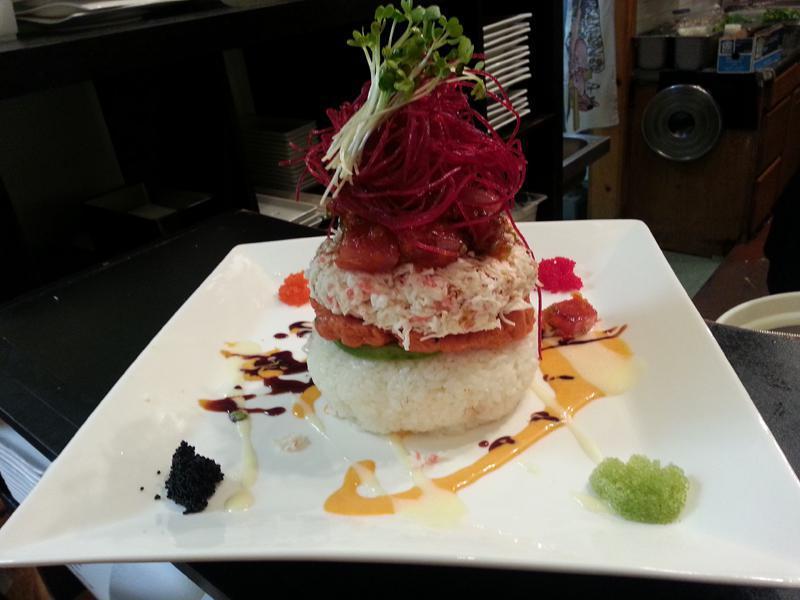 Sake Tower · Salmon, spicy tuna, crab meat, avocado, rice, masago, radish sprout built in tower, served with house special sauce. Raw. Spicy.