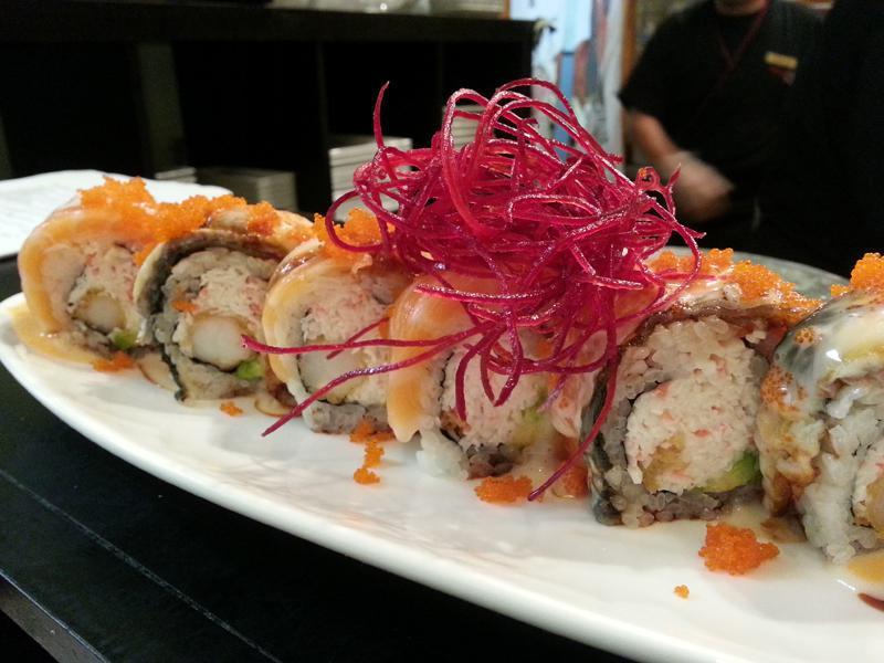 Lion King Roll · Shrimp tempura, crab meat, avocado, inside topped with salmon, eel, and masago, served with house special sauce. Raw.