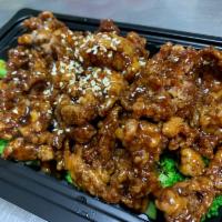 Sesame Beef  · Sweet red-brown glaze, broccoli, topped with toast sesame seeds.