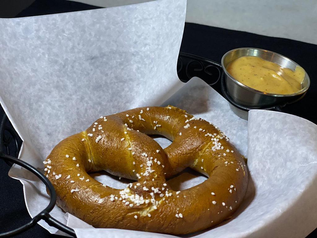 Beer Pretzel · Served with growlers signature beer cheese sauce.