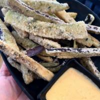 Eggplant Fries · Deep fried local eggplant served with our house made carrot aioli.