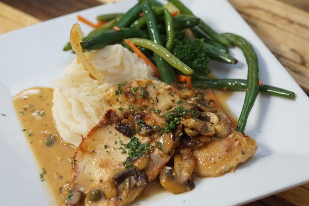 Chicken Piccata  · Sauteed with mushrooms, herbs and finished in wine with garlic mashed potatoes.