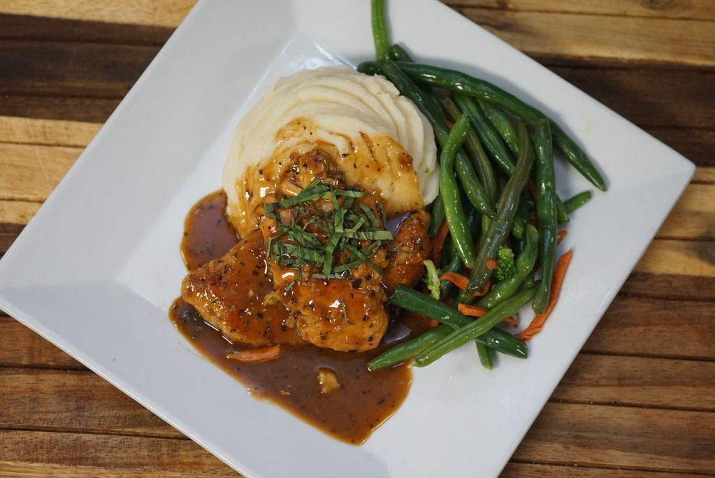 Chicken Marsala · Sauteed with mushrooms, herbs and finished in wine with garlic mashed potatoes.