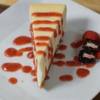 New York Style Cheese Cake · Served with fresh berries and strawberry sauce.
