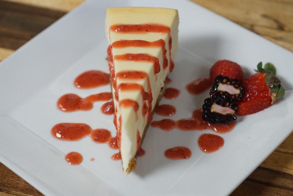 New York Style Cheese Cake · Served with fresh berries and strawberry sauce.