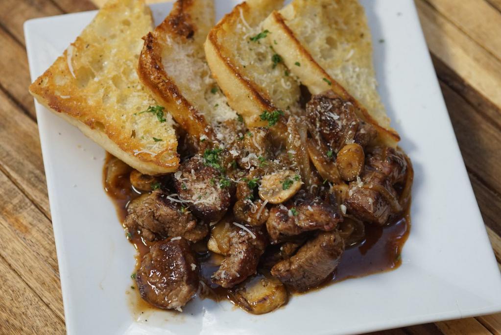 Beef Tenderloin Tips · Served with caramelized onions, mushrooms and demi-glaze.