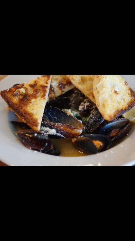 1/2 lb. Mussels · Served with white wine garlic sauce, arugula and ciabatta.