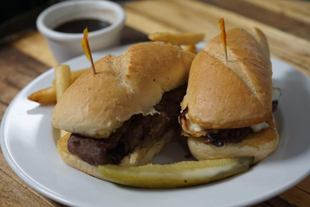 French Dip with Fries · Served with caramelized onions and mozzarella on a hoagie bun served with aujus.