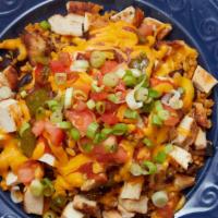 El Mexicana · Chicken or steak, sauteed green peppers and onions, reduced fat
cheddar, salsa, tomatoes an...