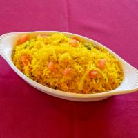 Rice Pillau · Basmati rice cooked with turmeric, green peas and tomatoes