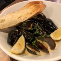 Fresh Black Mussels · White wine, garlic, shallots, creme and toasted baguette.