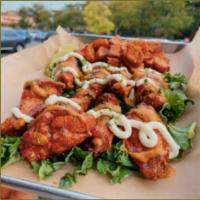 20 pc Harissa Glazed Wings · 20 Golden crispy chicken wings tossed in a sweet harissa hot sauce, topped with spicy tahini...