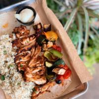 Chicken Shawarma Plate · Served with herb-basmati rice & roasted veggies, all atop a thin flatbread