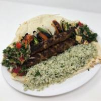 Lamb Kebob Plate · Served with herb-basmati rice, pine nuts, & roasted veggies, all atop a thin flatbread