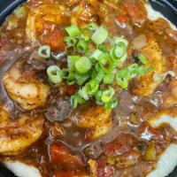 shrimp + grits · Gulf shrimp, smoked Gouda grit, Creole sauce.