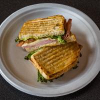 Grill Ham and Swiss Sandwich · Honey ham, Swiss cheese, Dijon mustard, lettuce and tomatoes served on sourdough bread panin...