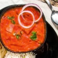 Vindaloo · Spicy curry sauce cooked with onions, bell peppers and potatoes. Served with basmati rice.