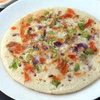 Uttapam · Uttapam are South Indian pancakes made with lentils, rice, onions, tomatoes, cilantro, herbs...