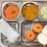 Idli Vada Sambar · 2 rice and lentil cakes and 2 lentil balls served with lentil soup, coconut chutney and fres...