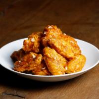 Honey Garlic Wings · A soy based sauce that is sweet and savory infused with pungent pieces of garlic.
