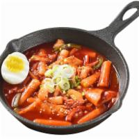 Ddeok-Bokki · Rice cake and fish cakes reduced in a sweet and spicy red chili sauce.