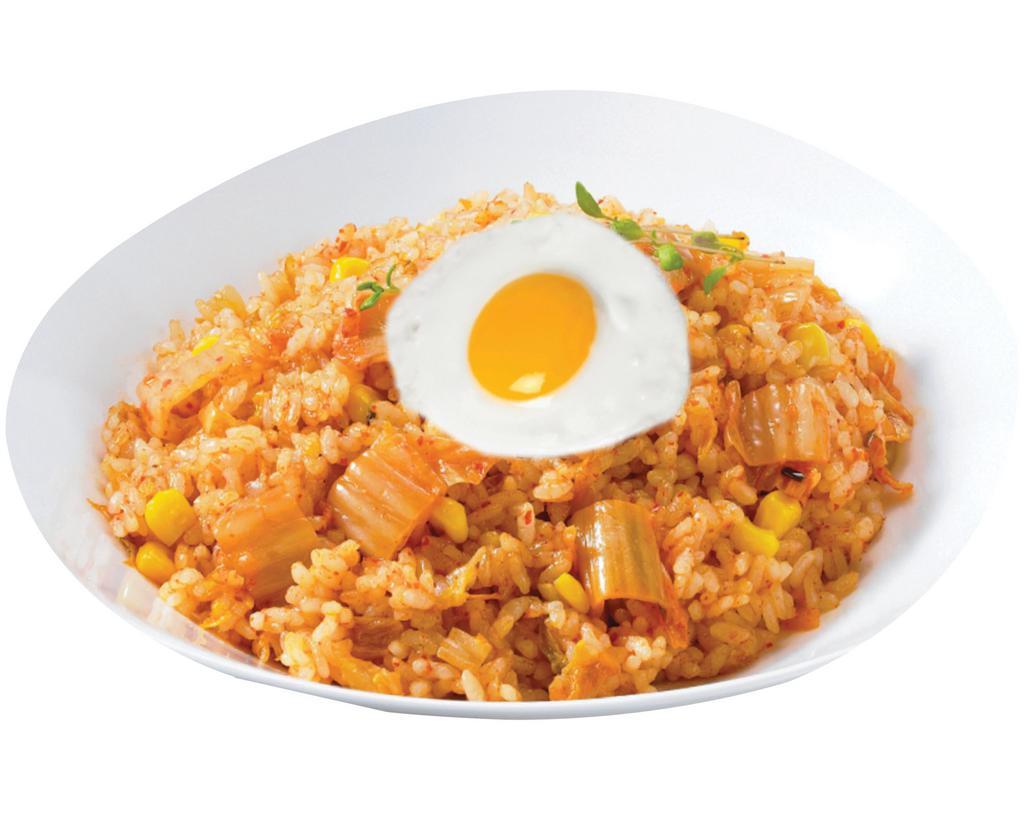 Kimchi Fried Rice · Stir fried rice with vegetables and kimchi base.