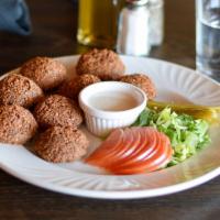 Small Falafel Plate · 4 pieces of falafel served with tahini sauce, lettuce, tomatoes and pickles.