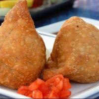 Veggie. Samosa · 2 pastries stuffed with spiced potatoes and peas and deep fried 