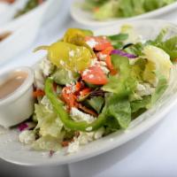 Mediterranean Greek Salad  · caspian house salad, topped with feta cheese, olive, walnut, pepperoncino, and house dressing