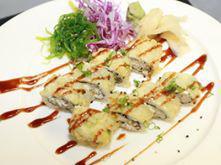 Dynamite Roll · White tuna, spicy tuna on the inside and black red tobika, green onion on the outside with h...