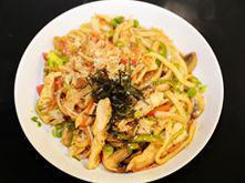 Chicken Yaki Udon · Stir-fried Japanese thick noodles with vegetables and spicy sauce.