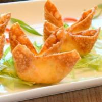 4. Crab Puffs · Golden wontons filled with cream cheese and imitation crab served with sweet and sour sauce.