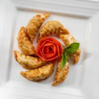 Potstickers · Pork dumplings served with sweet and sour sauce.