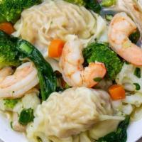 15. Wonton Soup · Wonton filled with seasoned ground pork and shrimp with broccoli, carrots, celery, shrimp, c...