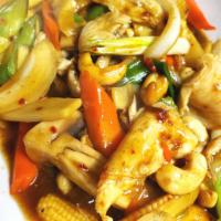 36. Cashew Delight · Roasted cashew nuts with bell peppers, onions, carrots, bamboo shoots, mushrooms and baby co...
