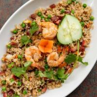 47. House Fried Rice · Vietnamese fried rice with eggs, Asian sausage, BBQ pork, shrimp, onions, peas and diced car...