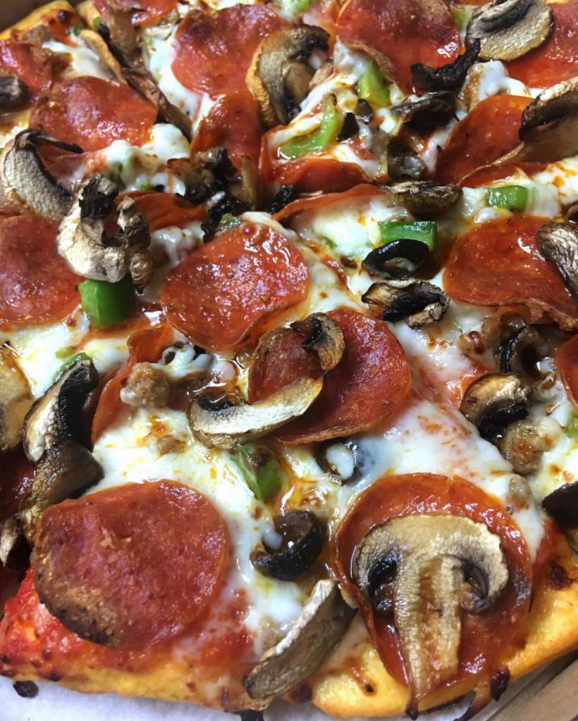 The Mayor · Pepperoni, ground beef, green pepper, black olives and mushroom