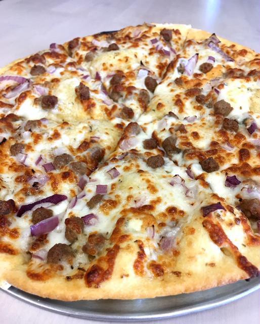 Black and Bleu Pizza · Ground beef, bleu cheese crumbles, red onion on our house-made white sauce.
