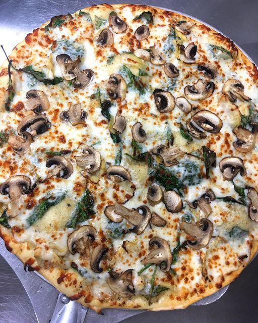 Spin-Art Pizza · Spinach, artichoke, mushroom on our house-made white sauce
