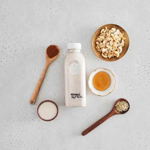 Almond Nut Milk · A blend of almond milk, Almond Butter, hemp seeds, probiotics, cinnamon, pink Himalayan salt, and local honey. 