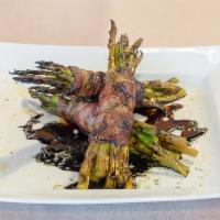 Bacon Wrapped Grilled Asparagus · 1/2 lb. of fresh asparagus wrapped in bacon then broiled and topped off with balsamic reduct...
